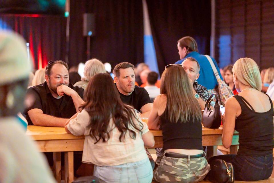 Guests sharing long tables